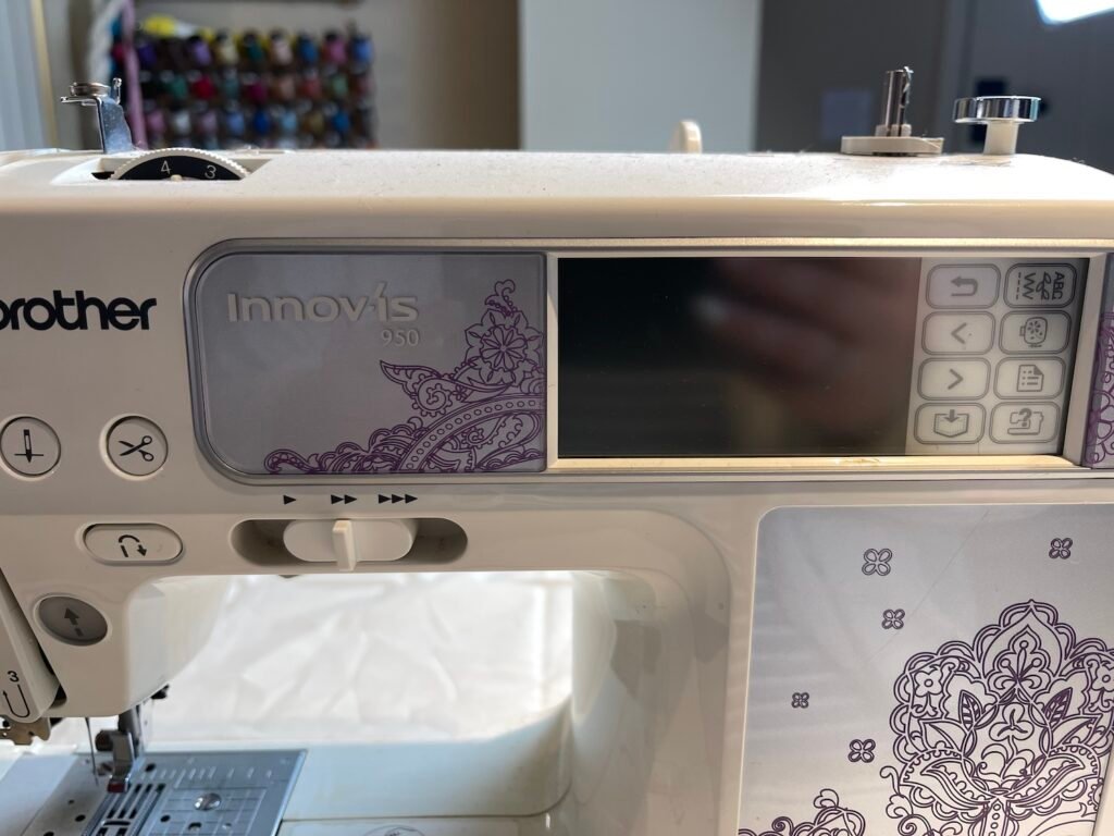 close up of Brother Innovis 950 sewing machine white and purple